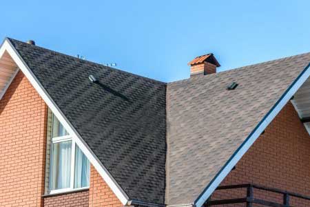 Gray shingle roof with chimney